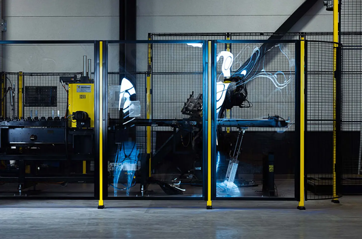 A industrial machine is shown with safety fencing used in front of it to protect from the hazard