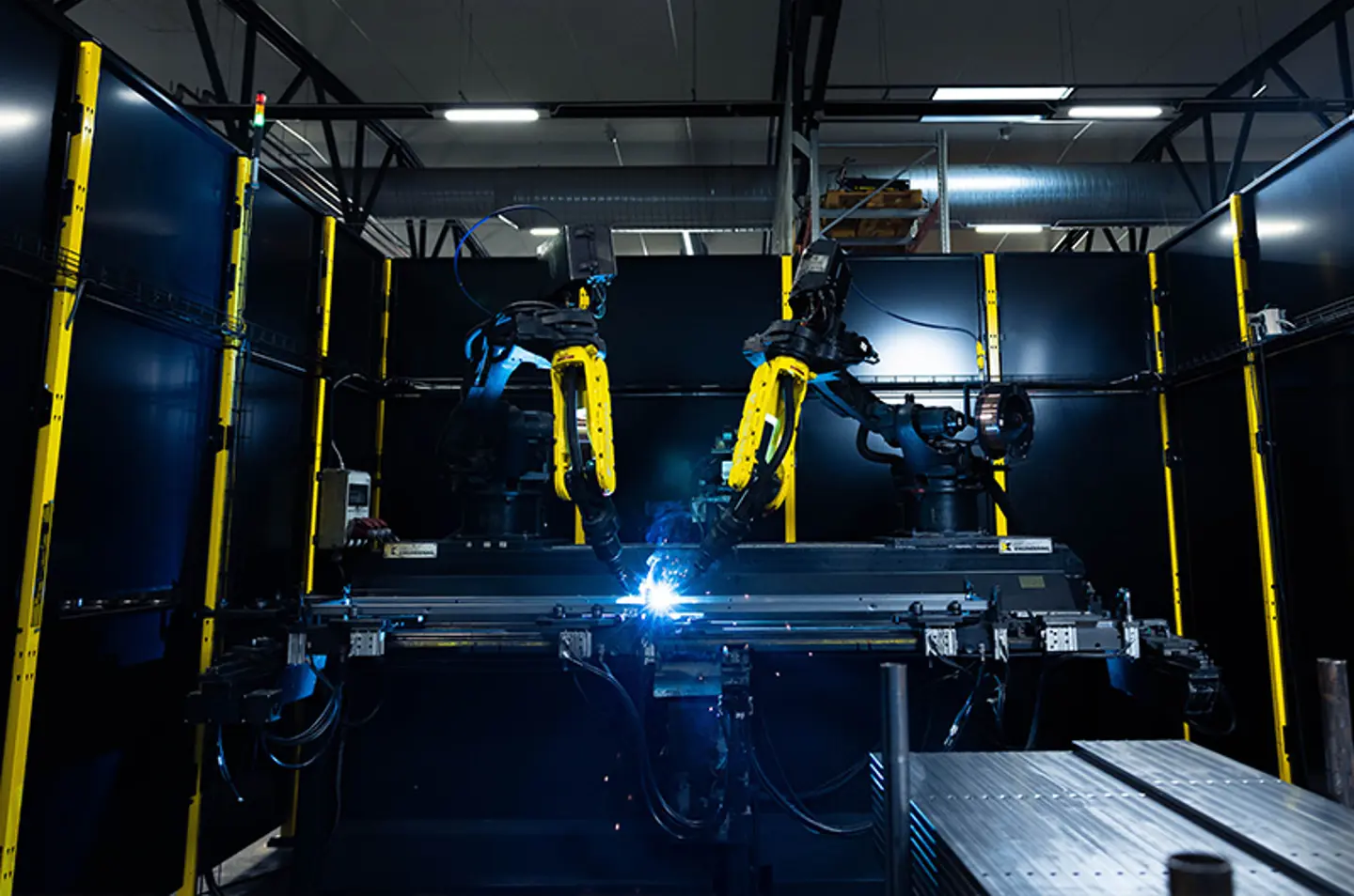 A industrial machine is shown with safety fencing used in front of it to protect from the hazard